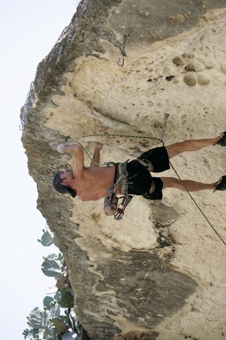 Tyler climbing Lonsome Dove (5.12), the roof above Diving for Rocks.  It was another long day of rock climbing at Seismic Wall on Austin's Barton Creek Greenbelt, Sunday, June 7, 2009.

Filename: SRM_20090607_13443294.jpg
Aperture: f/4.0
Shutter Speed: 1/500
Body: Canon EOS-1D Mark II
Lens: Canon EF 80-200mm f/2.8 L