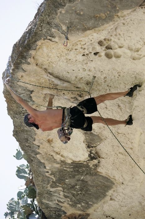 Tyler climbing Lonsome Dove (5.12), the roof above Diving for Rocks.  It was another long day of rock climbing at Seismic Wall on Austin's Barton Creek Greenbelt, Sunday, June 7, 2009.

Filename: SRM_20090607_13443599.jpg
Aperture: f/4.0
Shutter Speed: 1/500
Body: Canon EOS-1D Mark II
Lens: Canon EF 80-200mm f/2.8 L