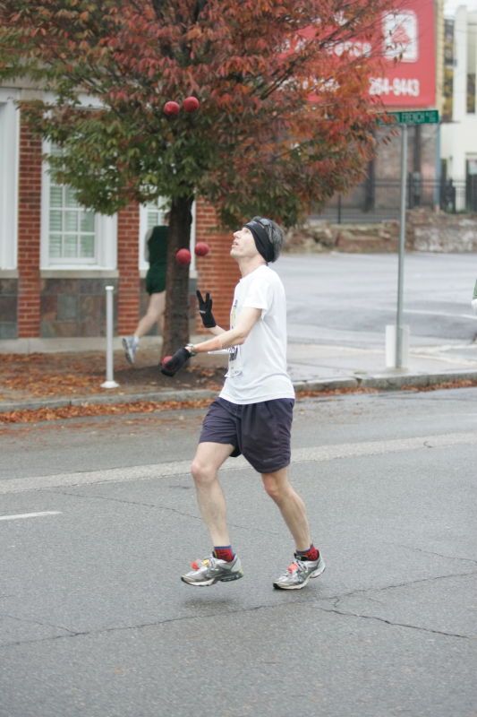 Barry Goldmeier, bib #16608 (8K) and  #5587 (marathon) juggling and running the 8K at the Richmond SunTrust Marathon and McDonald's Half Marathon, on Saturday, November 14, 2009.

Filename: SRM_20091114_07573158.JPG
Aperture: f/2.8
Shutter Speed: 1/320
Body: Canon EOS-1D Mark II
Lens: Canon EF 80-200mm f/2.8 L