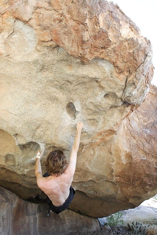 Andrew Dreher rock climbing on No One Gets Out of Here Alive (V2) in Hueco Tanks State Park and Historic Site during the Hueco Tanks Awesome Fest 2010 trip, Sunday, May 23, 2010.

Filename: SRM_20100523_10514633.JPG
Aperture: f/5.6
Shutter Speed: 1/320
Body: Canon EOS-1D Mark II
Lens: Canon EF 16-35mm f/2.8 L