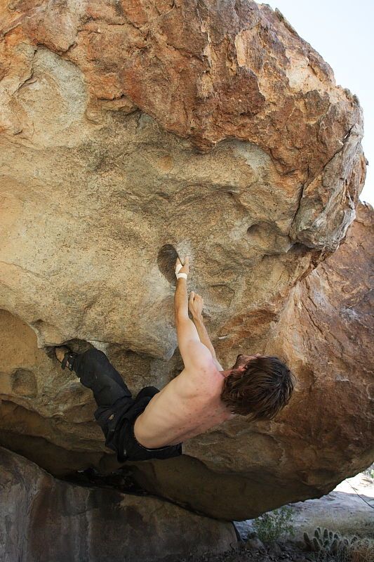 Andrew Dreher rock climbing on No One Gets Out of Here Alive (V2) in Hueco Tanks State Park and Historic Site during the Hueco Tanks Awesome Fest 2010 trip, Sunday, May 23, 2010.

Filename: SRM_20100523_10515735.JPG
Aperture: f/5.6
Shutter Speed: 1/640
Body: Canon EOS-1D Mark II
Lens: Canon EF 16-35mm f/2.8 L