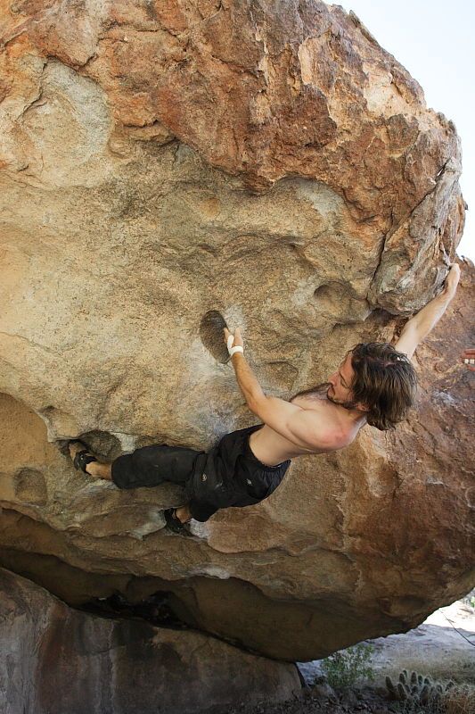 Andrew Dreher rock climbing on No One Gets Out of Here Alive (V2) in Hueco Tanks State Park and Historic Site during the Hueco Tanks Awesome Fest 2010 trip, Sunday, May 23, 2010.

Filename: SRM_20100523_10515943.JPG
Aperture: f/5.6
Shutter Speed: 1/640
Body: Canon EOS-1D Mark II
Lens: Canon EF 16-35mm f/2.8 L