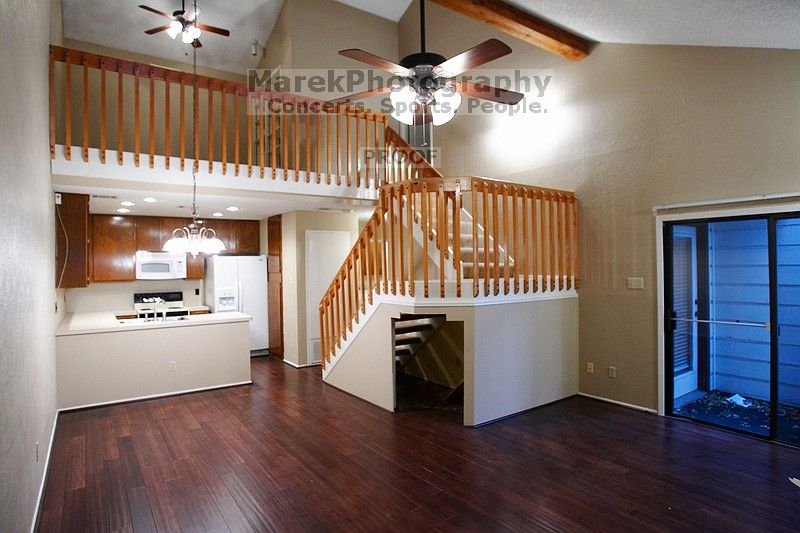 Entry into the great room, with vaulted ceilings. Stairs lead up to the loft and master bedroom suite. Bamboo floors throughout the first floor.

Filename: SRM_20101228_17420336.JPG
Aperture: f/2.8
Shutter Speed: 1/50
Body: Canon EOS-1D Mark II
Lens: Canon EF 16-35mm f/2.8 L