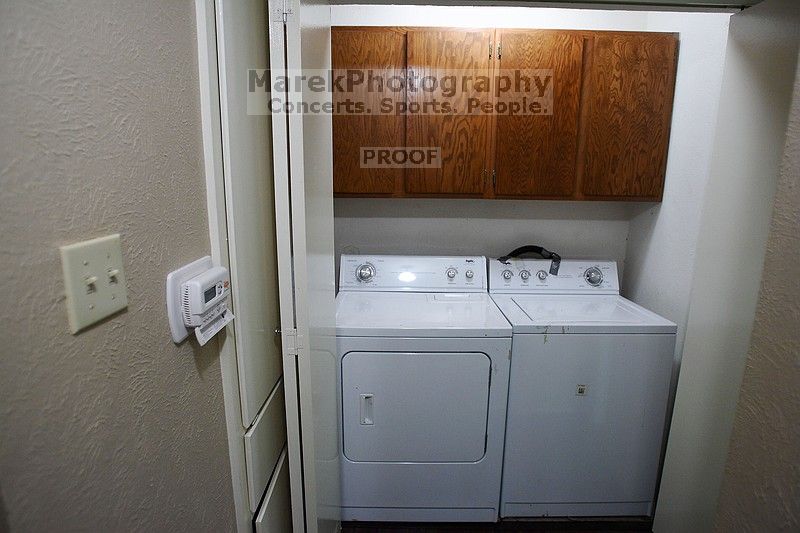 View of the laundry room. Washer and dryer are included. Programmable thermostat for heat/AC.

Filename: SRM_20101228_17514956.JPG
Aperture: f/2.8
Shutter Speed: 1/60
Body: Canon EOS-1D Mark II
Lens: Canon EF 16-35mm f/2.8 L