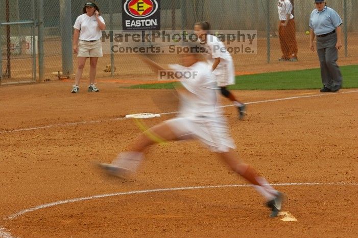 Cat Osterman pitching to the Mean Green.  The Lady Longhorns beat the University of North Texas 5-0 in the first game of the double header Wednesday night.

Filename: SRM_20060308_210043_2.jpg
Aperture: f/7.1
Shutter Speed: 1/20
Body: Canon EOS 20D
Lens: Canon EF 80-200mm f/2.8 L