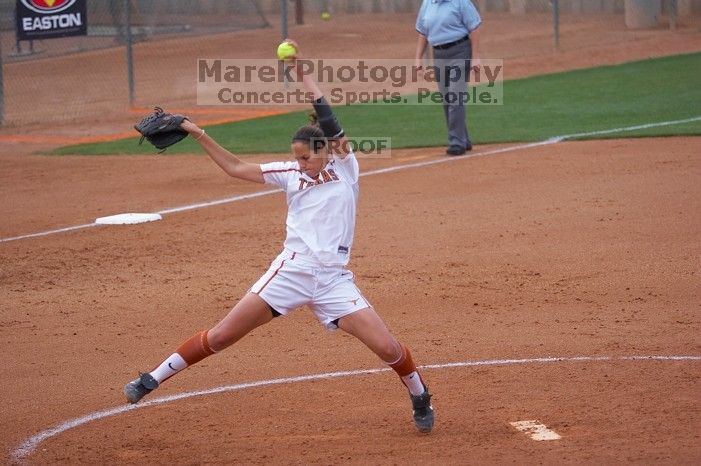 Cat Osterman pitching to the Mean Green. The Lady Longhorns beat the University of North Texas 5-0 in the first game of the double header Wednesday night.
Filename: SRM_20060308_204301_1.jpg
Aperture: f/2.8
Shutter Speed: 1/1250
Body: Canon EOS 20D
Lens: Canon EF 80-200mm f/2.8 L