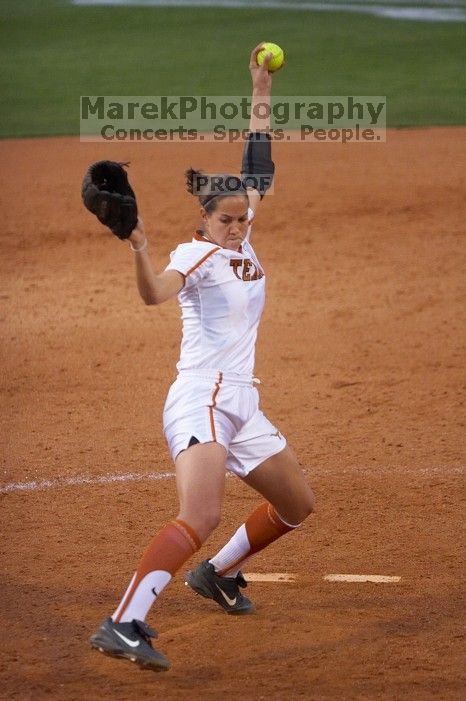 Cat Osterman pitching to the Mean Green.  The Lady Longhorns beat the University of North Texas 5-0 in the first game of the double header Wednesday night.

Filename: SRM_20060308_212034_0.jpg
Aperture: f/2.8
Shutter Speed: 1/1000
Body: Canon EOS 20D
Lens: Canon EF 80-200mm f/2.8 L