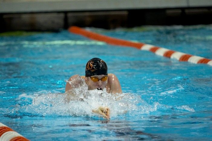 Matthew Lowe of the University of Texas Men's Varsity Swim Team placed 4th in the last heat of the 200 IM Prelims with a time of 1:50.11 at the Speedo American Short Course Championships.

Filename: SRM_20060304_105242_6.jpg
Aperture: f/2.8
Shutter Speed: 1/320
Body: Canon EOS 20D
Lens: Canon EF 80-200mm f/2.8 L