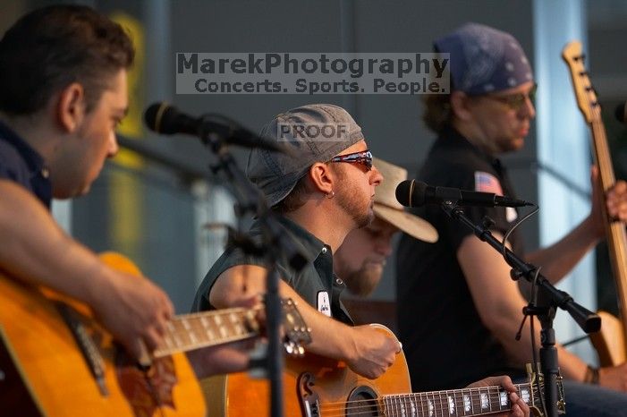 The Gene Pool, performing at the Austin airport.  Geno Stroia II on vocals/guitar, Jorge Castillo on vocals/guitar, Travis Woodard on drums and Steven Ray Will on vocals/bass guitar.

Filename: SRM_20060518_155006_5.jpg
Aperture: f/2.8
Shutter Speed: 1/200
Body: Canon EOS 20D
Lens: Canon EF 80-200mm f/2.8 L