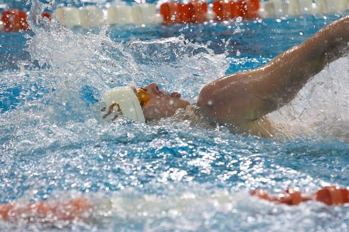 Matthew Lowe of the University of Texas Men's Varsity Swim Team placed 6th in the last heat of the 200 IM Finals with a time of 1:50.02 at the Speedo American Short Course Championships.

Filename: SRM_20060304_192256_3.jpg
Aperture: f/3.5
Shutter Speed: 1/800
Body: Canon EOS 20D
Lens: Canon EF 80-200mm f/2.8 L