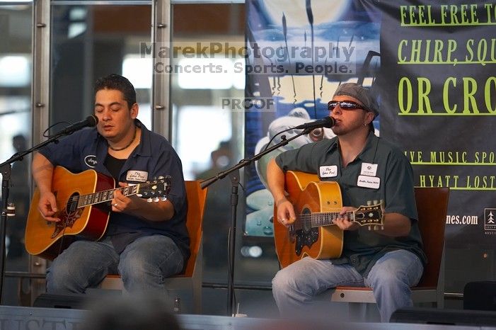 The Gene Pool, performing at the Austin airport.  Geno Stroia II on vocals/guitar, Jorge Castillo on vocals/guitar, Travis Woodard on drums and Steven Ray Will on vocals/bass guitar.

Filename: SRM_20060518_154856_6.jpg
Aperture: f/2.8
Shutter Speed: 1/200
Body: Canon EOS 20D
Lens: Canon EF 80-200mm f/2.8 L