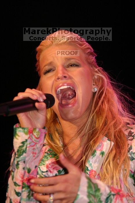 Jessica Simpson performs on the third day of Music Midtown, 2004.

Filename: IMG_7331.jpg
Aperture: f/2.8
Shutter Speed: 1/250
Body: Canon EOS DIGITAL REBEL
Lens: Canon EF 80-200mm f/2.8 L