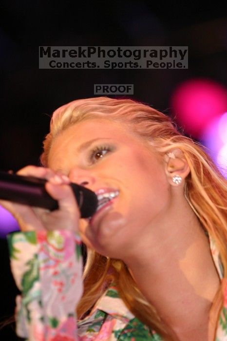 Jessica Simpson performs on the third day of Music Midtown, 2004.

Filename: IMG_7327.jpg
Aperture: f/2.8
Shutter Speed: 1/250
Body: Canon EOS DIGITAL REBEL
Lens: Canon EF 80-200mm f/2.8 L