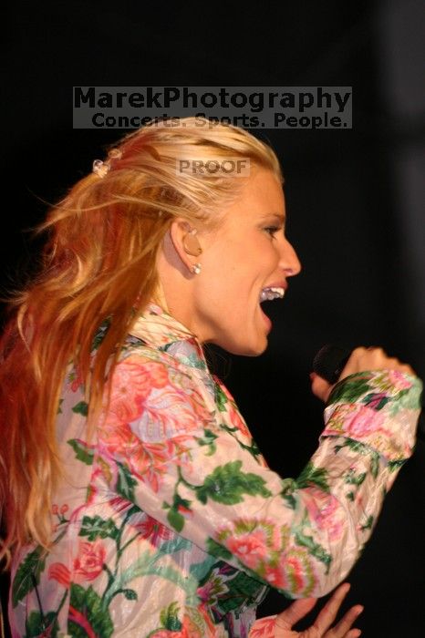 Jessica Simpson performs on the third day of Music Midtown, 2004.

Filename: IMG_7341.jpg
Aperture: f/2.8
Shutter Speed: 1/250
Body: Canon EOS DIGITAL REBEL
Lens: Canon EF 80-200mm f/2.8 L