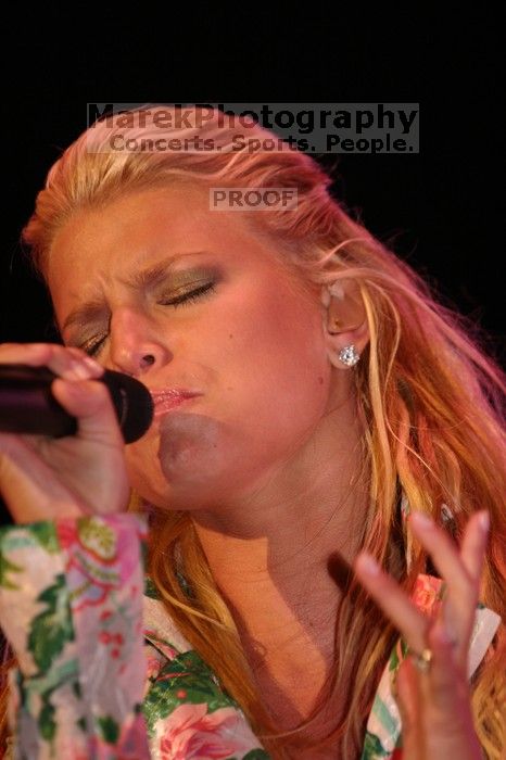 Jessica Simpson performs on the third day of Music Midtown, 2004.

Filename: IMG_7333.jpg
Aperture: f/2.8
Shutter Speed: 1/250
Body: Canon EOS DIGITAL REBEL
Lens: Canon EF 80-200mm f/2.8 L