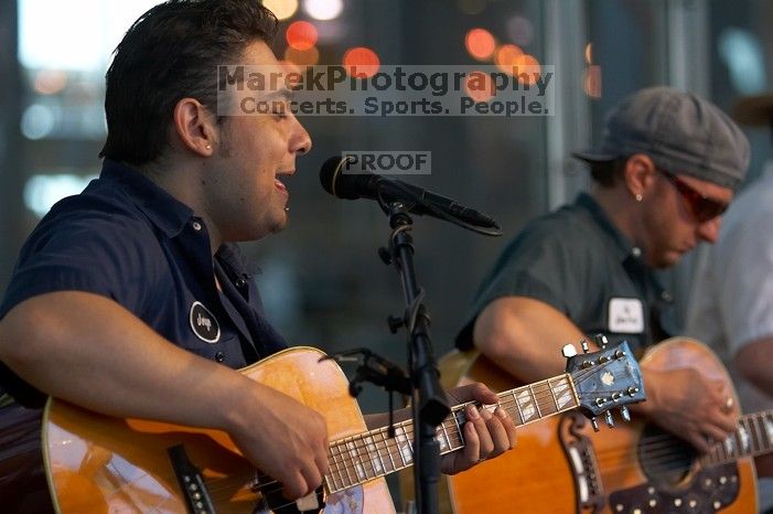 The Gene Pool, performing at the Austin airport.  Geno Stroia II on vocals/guitar, Jorge Castillo on vocals/guitar, Travis Woodard on drums and Steven Ray Will on vocals/bass guitar.

Filename: SRM_20060518_155534_9.jpg
Aperture: f/2.8
Shutter Speed: 1/250
Body: Canon EOS 20D
Lens: Canon EF 80-200mm f/2.8 L