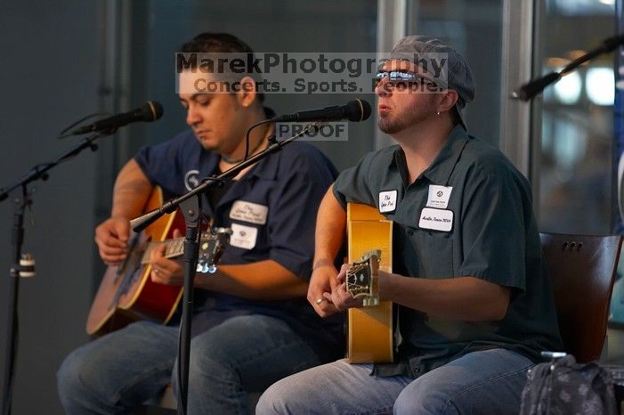 The Gene Pool, performing at the Austin airport.  Geno Stroia II on vocals/guitar, Jorge Castillo on vocals/guitar, Travis Woodard on drums and Steven Ray Will on vocals/bass guitar.

Filename: SRM_20060518_154824_1.jpg
Aperture: f/2.8
Shutter Speed: 1/200
Body: Canon EOS 20D
Lens: Canon EF 80-200mm f/2.8 L