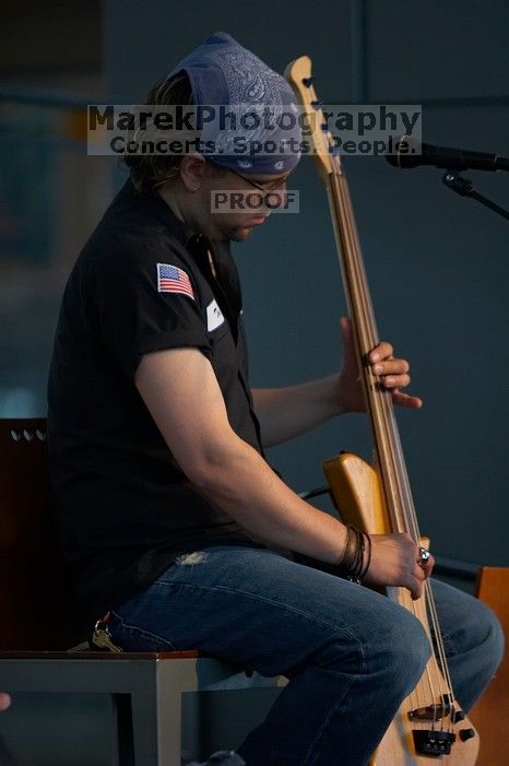 The Gene Pool, performing at the Austin airport.  Geno Stroia II on vocals/guitar, Jorge Castillo on vocals/guitar, Travis Woodard on drums and Steven Ray Will on vocals/bass guitar.

Filename: SRM_20060518_155612_0.jpg
Aperture: f/2.8
Shutter Speed: 1/250
Body: Canon EOS 20D
Lens: Canon EF 80-200mm f/2.8 L