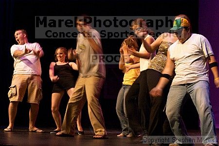 Dance contest in between acts at the Mock Rock competition at the Ferst Center.

Filename: crw_1675_std.jpg
Aperture: f/8.0
Shutter Speed: 1/20
Body: Canon EOS DIGITAL REBEL
Lens: Canon EF 80-200mm f/2.8 L