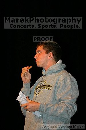 Cookie Eating contest in between acts at the Mock Rock competition at the Ferst Center.  The male student in gray and the female student in navy blue were the winners.                                                                                        

Filename: img_1768_std.jpg
Aperture: f/2.8
Shutter Speed: 1/160
Body: Canon EOS DIGITAL REBEL
Lens: Canon EF 80-200mm f/2.8 L