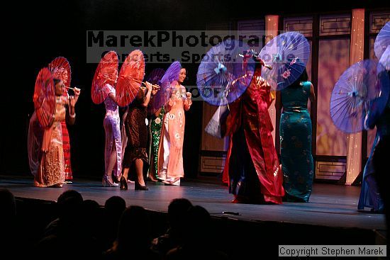 Miss Asian Atlanta pageant, 2004.

Filename: img_0787_std.jpg
Aperture: f/2.8
Shutter Speed: 1/40
Body: Canon EOS DIGITAL REBEL
Lens: Canon EF 80-200mm f/2.8 L